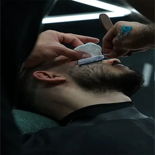 picture of costumer waxing his beard